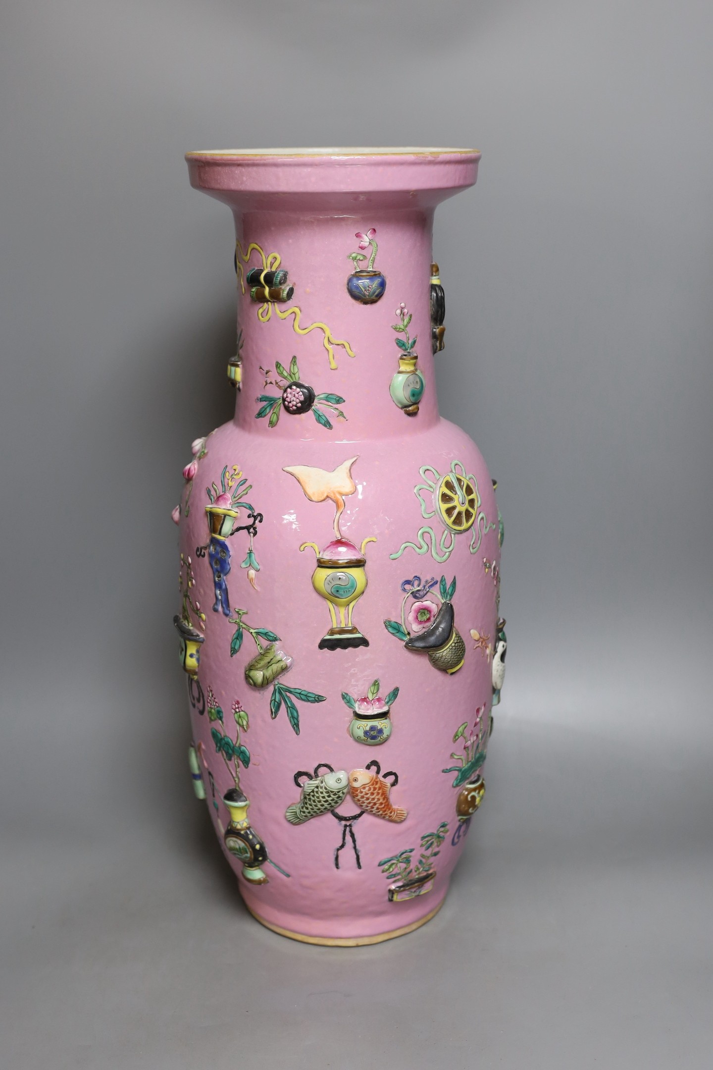 A large Chinese pink ground ‘Hundred Antiques’ vase, 49 cms high.